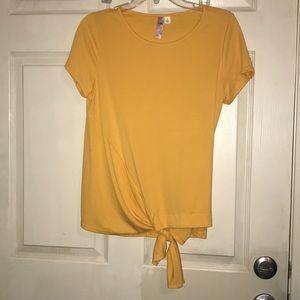 Yellow shirt with tie in the front